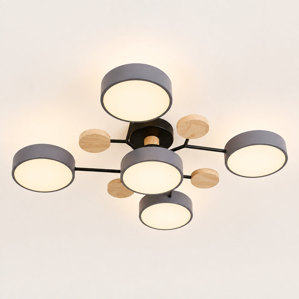 Plafonnier LED gris allumé, lumière diffusée par les cinq palets